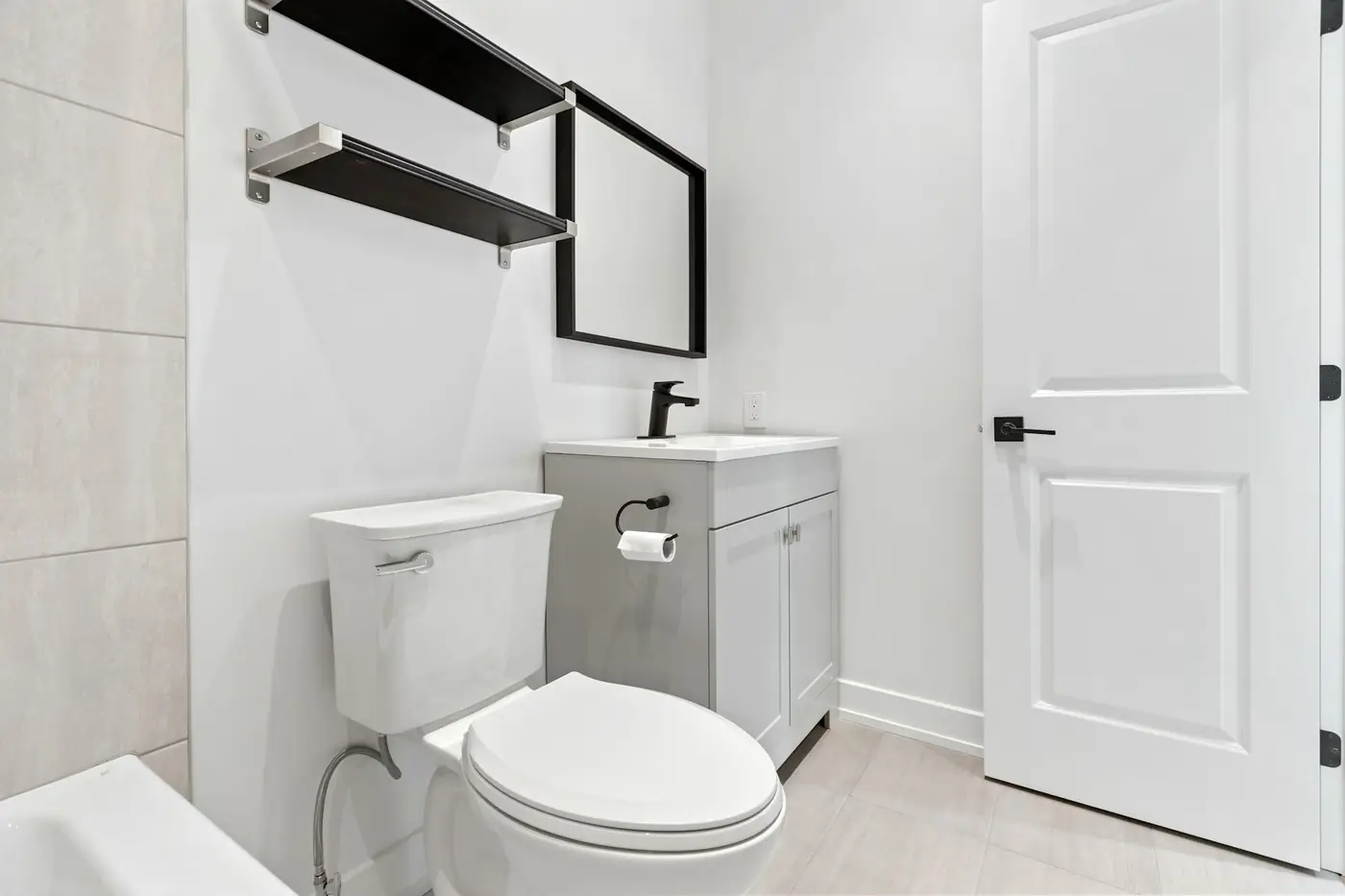 Bathroom with a newly installed toilet next to the vanity