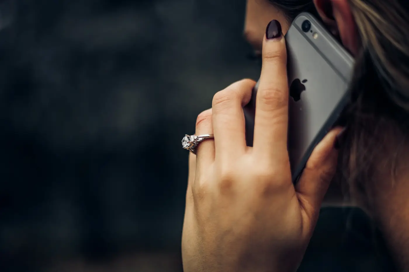 Person on a phone call asking for plumbing help