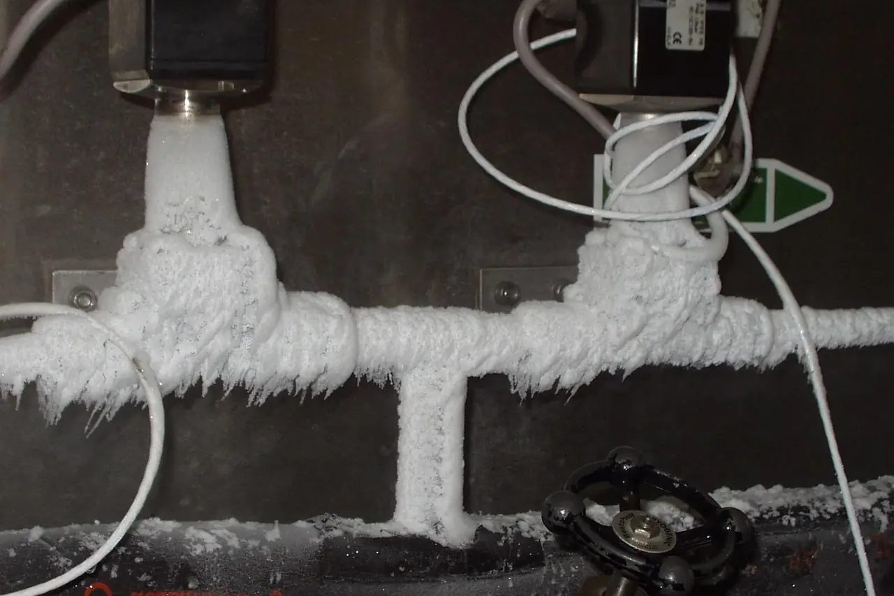 Water pipes covered in thick frost, a sign they are about to freeze