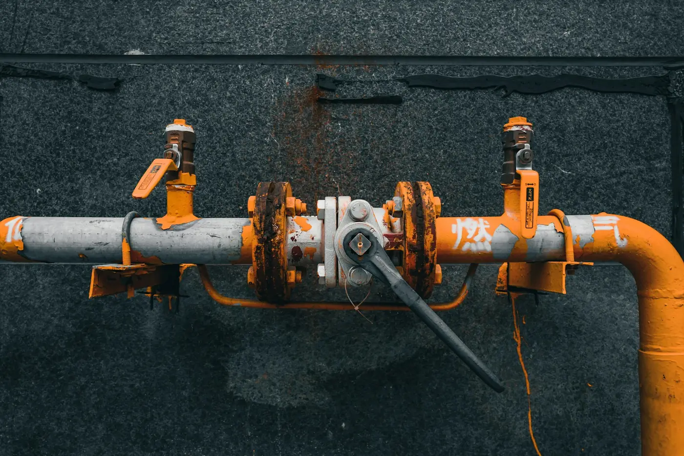 Gas pipes with a shut-off valve on an outside wall